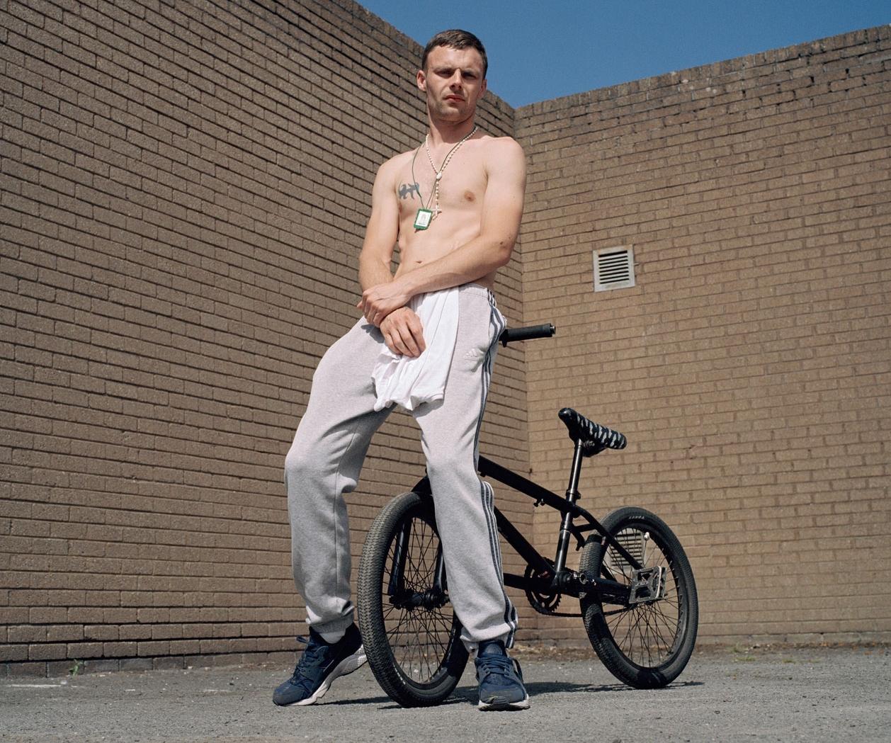 Stephen. <br> Too Hot for Tops<br>is a study of men who <br> venture onto Dublin’s streets <br> unselfconsciously bare-chested <br> on a summer’s day. <br> 1 of 20 